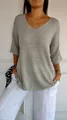 Detailed view of a grey V-neck knit sweater with loose sleeves and soft texture - Light Gray