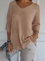 Detail view of a women's casual V-neck lightweight knit sweater in beige styled with jewelry - Beige