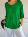 Close-up of a women's casual green V-neck knit sweater, showing texture and relaxed fit style. - S / Tops / Bright Green