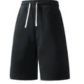 Close-up of black men's loose casual shorts with contrasting white drawstring detail - M / Bottoms / Black