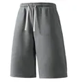 Close-up detail of grey men's casual loose shorts with elastic waistband and drawstring - M / Bottoms / Dark Gray