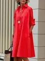 Elegant woman wearing a vibrant red long-sleeved cotton linen midi shirt dress outdoors. - S / Tops / Red