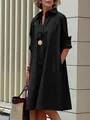 Elegant woman wearing a black cotton linen loose button-down midi shirt dress outside. - M / Top And Bottom / Black