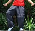 Detail shot of loose-fit wide-leg cargo pants for men in a trendy hip hop plus size style - S / Bottoms / Gray