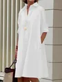A full view of an elegant white cotton linen button-down midi shirt dress on a model - S / Tops / White