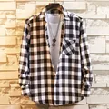 Detail shot of a men's classic black and white checkered flannel long-sleeve shirt - L / Tops / White & Black Plaid