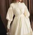 Detail of a vintage cream maid style dress featuring puff sleeves and button cuffs - S / Top And Bottom / Beige