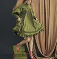 Full view of the green Victorian style ruffled mini dress with puffy long sleeves - S / Top And Bottom / Green