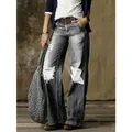Jeans larghi grigi vintage da donna con dettagli strappati e diverse finiture usurate - Grigio Invecchiato
