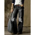 Jeans vintage a gamba larga da donna in lavaggio scuro con ginocchia strappate - Nero Invecchiato