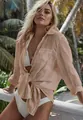 Detalle de la camisa playera de tela arrugada color melocotón con nudo frontal - Talla única / Tops / Albaricoque