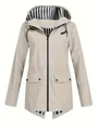 Detail view of lightweight beige women's outdoor windbreaker jacket with striped hood lining - Apricot