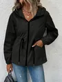 Detail view of a black hooded waterproof windbreaker with adjustable drawstring waist. - S / Tops / Black