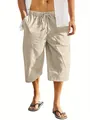 Detailed view of men's beige cotton linen beach shorts with unique multi-pocket design. - Apricot