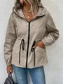 Detailed view of a khaki waterproof hiking jacket with a hooded collar and drawstring waist. - S / Tops / Khaki