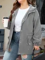 Women's grey hooded outdoor waterproof jacket styled with white tee and jeans - Gray