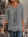 Detailed view of women's gray casual shirt with unique double-layered hem design - S / Tops / Gray