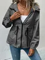 Close-up detail of a grey waterproof windbreaker jacket with adjustable drawstring waist - S / Tops / Dark Gray