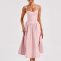 Elegant detail showing the bustier bodice of a French retro light pink midi dress - Pink