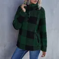 Detailed view of women's green and black plaid fleece pullover with buttoned high collar - S / Tops / Green