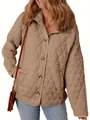 Close-up detail of a beige quilted jacket featuring a stylish diamond pattern and buttons. - S / Tops / Khaki