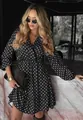 Elegant black polka dot V-neck long sleeve dress worn by a model in a stylish setting - S / Black