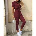 Chic burgundy short sleeve utility jumpsuit with adjustable waist belt and collar detail - Burgundy