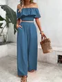 Close-up of off-shoulder smocked ruffle top and matching wide-leg trousers set in blue - Blue