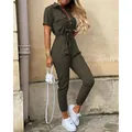 Side view of woman wearing olive green short sleeve utility jumpsuit with belt - S / Top And Bottom / Army Green