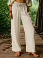 Detailed shot of beige cotton linen wide-leg trousers with an elastic drawstring waist - S / Bottoms / Apricot