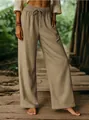 Close-up of khaki cotton linen wide-leg trousers featuring elastic drawstring waistline - S / Bottoms / Khaki