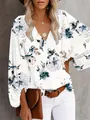 Elegante weiße Bluse mit V-Ausschnitt, Blumenmuster und modischen Laternenärmeln - Weiße Blume