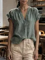 Detailed view of a sage green V-neck cotton linen top featuring ruffled short sleeves - S / Tops / Dark Green