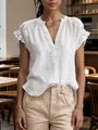 Detailed shot of white bohemian V-neck cotton linen blouse featuring ruffle sleeve details - S / Tops / White