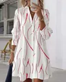 Vue détaillée d'une robe chemise blanche élégante avec un motif de vagues rouges vif - S / Bas / Blanc et Rouge
