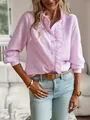 Detailed view of a pink striped blouse featuring elegant ruffle trim and long sleeves. - S / Tops / Pink