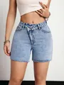 Detail of light wash denim shorts with unique crossover buttoned waistband - XS / Bottoms / Blue
