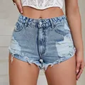 Chic high-waisted light blue distressed denim shorts featuring raw hem and ripped details - L (30) / Bottoms / Medium Blue