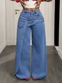Detailed view of high waist wide leg denim jeans with unique asymmetric overlap design - S (26) / Bottoms / Dark Blue