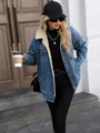 Detailed view of women's oversized blue denim jacket featuring warm plush fleece lining - XS / Tops / Dark Blue