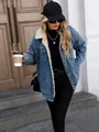 Detailed view of women's oversized blue denim jacket featuring warm plush fleece lining - XS / Tops / Dark Blue