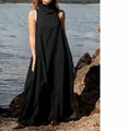 Full length view of a black sleeveless cotton maxi dress on a rocky shoreline - S / Top And Bottom / Black