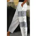 Side view of women's casual trousers featuring striped and checkered patchwork details - White