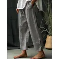 Detail view of men's grey pinstripe casual trousers with unique side slits and drawstring. - S / Bottoms / Graphite