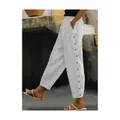 Detail of women's striped casual trousers featuring decorative side buttons and fabric texture - Grandma Grey