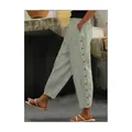 Detailed side view of women's grey vertical striped casual pants featuring button accents. - Light Green