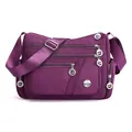 Stylish purple waterproof nylon crossbody bag with multiple functional zipper pockets. - Purple