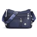 Multi-compartment navy blue waterproof nylon crossbody bag with adjustable strap - Blue