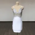Detailed view of white bandage dress with sparkling sequins and dangling fringe tassels - S / Bottoms / White