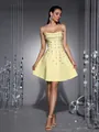 Detailed view of yellow strapless gala dress featuring heavy rhinestone embellishments - XS / Tops / Yellow